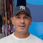 Smiling man in a baseball cap