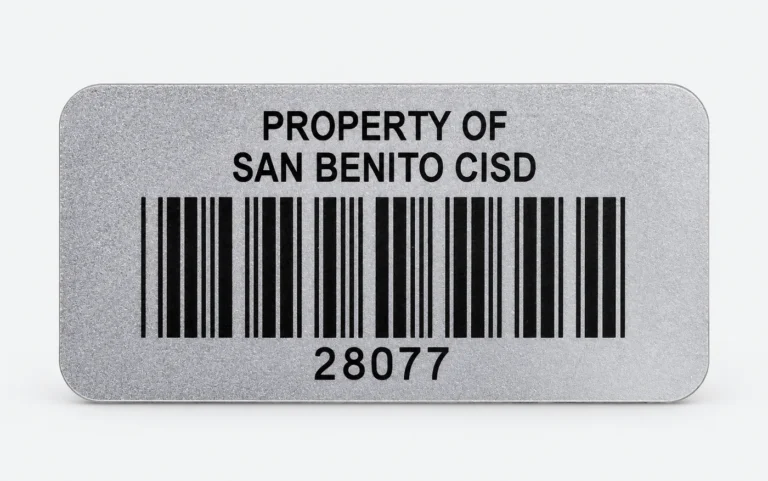 Silver polyester asset tag reading Property of San Benito CISD with a barcode and the number 28077